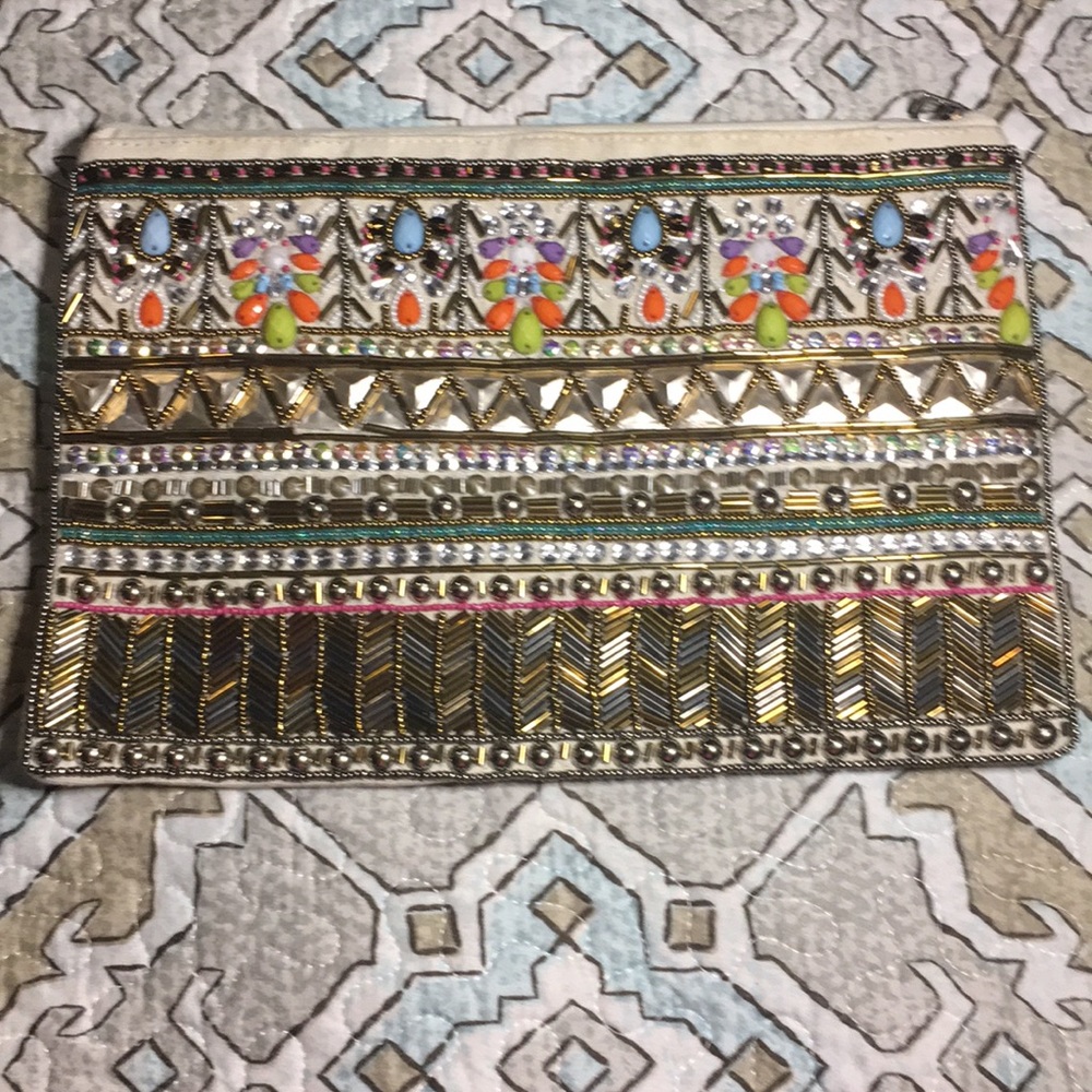Beaded canvas zipper clutch.
